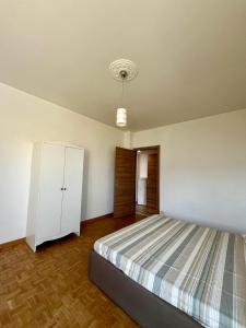 Voodi või voodid majutusasutuse Appartamento SOLE&LAGO sul lago d'Iseo a Sarnico toas