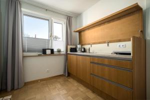 a kitchen with a counter top and a window at Ferienappartement Morgenröte 1 in Mirow