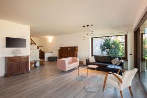 a living room with a couch and a table at Villa Manuela-Vista Lago in Brenzone sul Garda