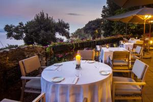 a dining table with a candle on top of it at Hotel Piccolo Portofino in Portofino