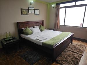 Postel nebo postele na pokoji v ubytování Royal Vista - Guest House