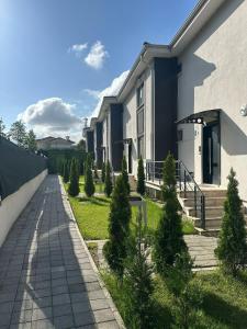 a house with christmas trees in front of it at EDİ Group Turizm Sapanca Villas in Sapanca