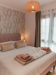 Łóżko lub łóżka w pokoju w obiekcie Lanzarote Villa Ascanio