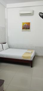 Postel nebo postele na pokoji v ubytování Mango Garden Hoi An Homestay