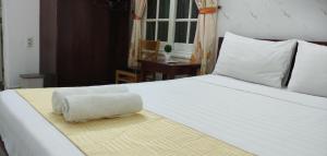Postel nebo postele na pokoji v ubytování Mango Garden Hoi An Homestay