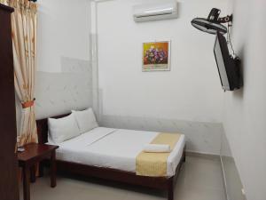 Postel nebo postele na pokoji v ubytování Mango Garden Hoi An Homestay