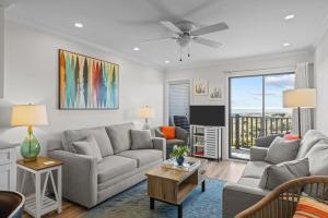 a living room with a couch and a table at Southwinds G10 Ocean View condo in Atlantic Beach