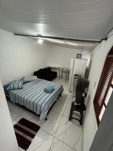 En eller flere senge i et værelse på Arraial suíte