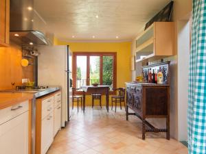 a kitchen with a table and a dining room at Son Senyor in Sa Pobla