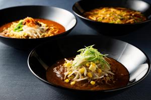 three bowls of food sitting on a table at The Prince Park Tower Tokyo - Preferred Hotels & Resorts, LVX Collection in Tokyo