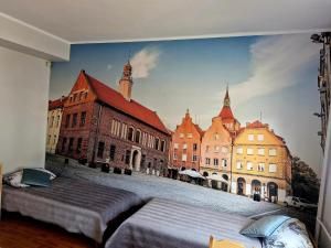 Łóżko lub łóżka w pokoju w obiekcie Szkolne Schronisko Mlodziezowe w Olsztynie