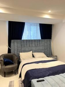 Postel nebo postele na pokoji v ubytování Blue Apartment
