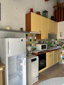 Kuchyň nebo kuchyňský kout v ubytování Maison Cosy