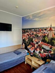 Łóżko lub łóżka w pokoju w obiekcie Szkolne Schronisko Mlodziezowe w Olsztynie