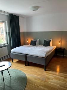 Postel nebo postele na pokoji v ubytování Botanika Uppsala