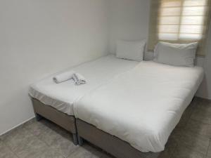 Bella Vista House - בלה ויסטה האוס客房内的一张或多张床位