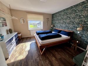 Postel nebo postele na pokoji v ubytování Ferienwohnung Weidentriesch