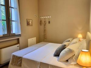 Postel nebo postele na pokoji v ubytování Agriturismo Cascina Carai