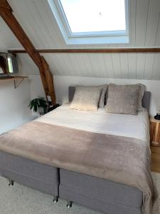 Postel nebo postele na pokoji v ubytování B&B De Vrijbuiter
