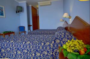 Postel nebo postele na pokoji v ubytování Astir Palace Hotel