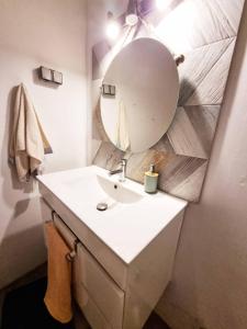 a bathroom with a sink and a mirror at Sun & Fun in Armacao de Pera in Armação de Pêra