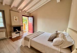 Postel nebo postele na pokoji v ubytování Agriturismo Cascina Carai