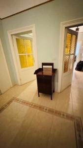 a room with a wooden table and a door at apt via cernaia rome center in Rome