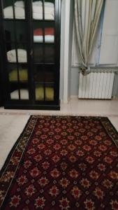 a rug on the floor in front of a door at apt via cernaia rome center in Rome