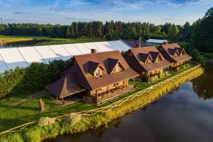 an aerial view of a house on a river at Cyziówka in Kamionka