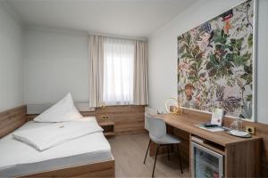 Postel nebo postele na pokoji v ubytování Hotel Kongress