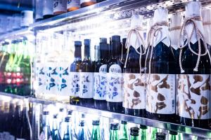 a refrigerator filled with lots of bottles of wine at The Prince Park Tower Tokyo - Preferred Hotels & Resorts, LVX Collection in Tokyo