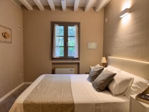 Postel nebo postele na pokoji v ubytování Agriturismo Cascina Carai