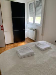 Ένα ή περισσότερα κρεβάτια σε δωμάτιο στο Apartman Sopia