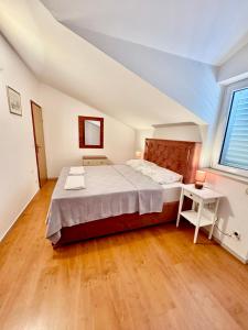Postel nebo postele na pokoji v ubytování Apartments Dani