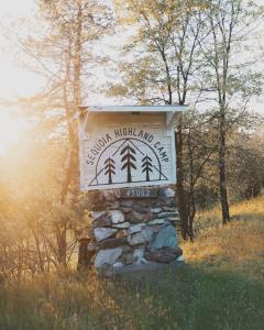 a sign for a mountain highgrass inn in a field at Secluded rustic 2-bedroom cabin on nature retreat in Miramonte