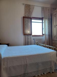 Postel nebo postele na pokoji v ubytování Verde Mare apartment Rosignano Marittimo