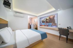TV a/nebo společenská místnost v ubytování Shengmeiya Apartment Hotel-Line8 Pazhou STN entrance D-Walking distance to Canton Fair