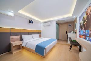 Postel nebo postele na pokoji v ubytování Shengmeiya Apartment Hotel-Line8 Pazhou STN entrance D-Walking distance to Canton Fair