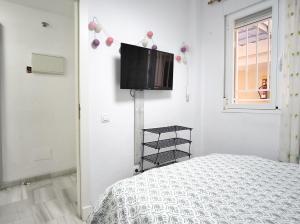 Et tv og/eller underholdning på BS Apartamento Buenavista Playa estancia min 6 noches A 2 minutos de la playa