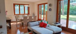 a living room with a couch and a table at Villa Lanzini in Casa Mora