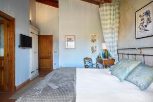 Postel nebo postele na pokoji v ubytování Hotel Barosse