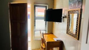 TV a/nebo společenská místnost v ubytování sediba guest house