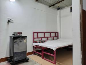 a small room with a small bed in it at Annada Homestay in Rānchī
