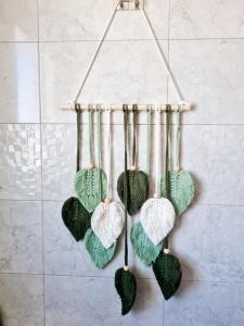a group of hearts hanging on a wall at Apartamento Arena y Sal in Barbate