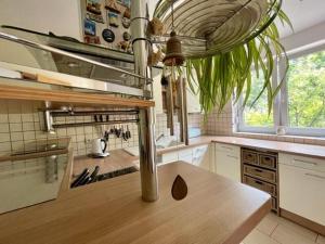 a kitchen with a wooden counter top in a kitchen at Haus in Ossendorf Köln in Cologne