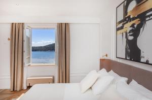 Postel nebo postele na pokoji v ubytování Ragusina luxury apartments