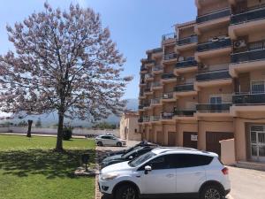 a white car parked in front of a building at Vista Segária, Playa Deveses in Denia +10 photos