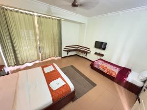 Letto o letti in una camera di Hotel SilverLine Regency Munnar