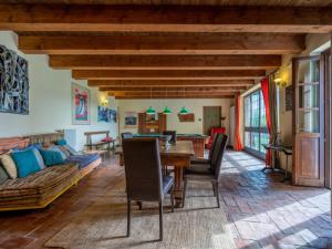 a living room with a table and a couch at Agriturismo La Rovere - Casale De Rovere in Cossano Belbo