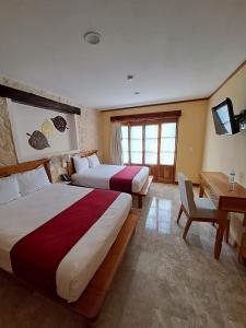 Postel nebo postele na pokoji v ubytování Cancun International Suites